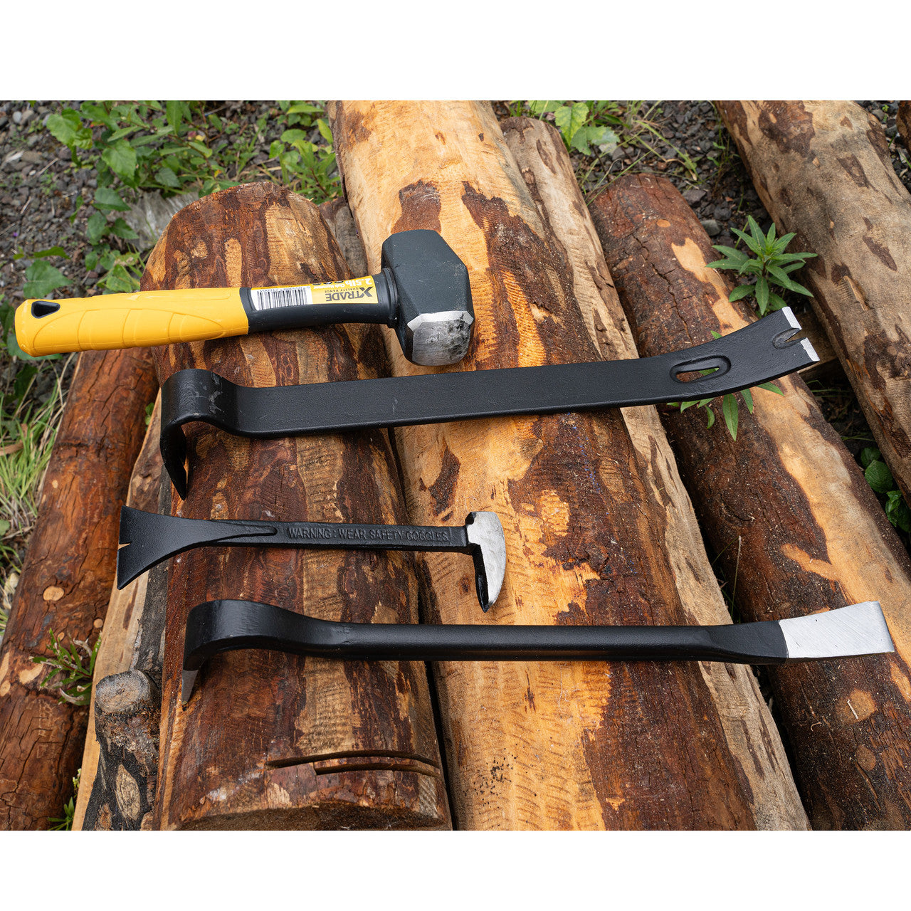 XTrade X0900006 Pry Bar Set (3 Piece) sitting on logs