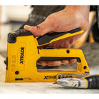 XTrade X0900073 Heavy Duty Staple Gun 4 in 1 being used in flooring application