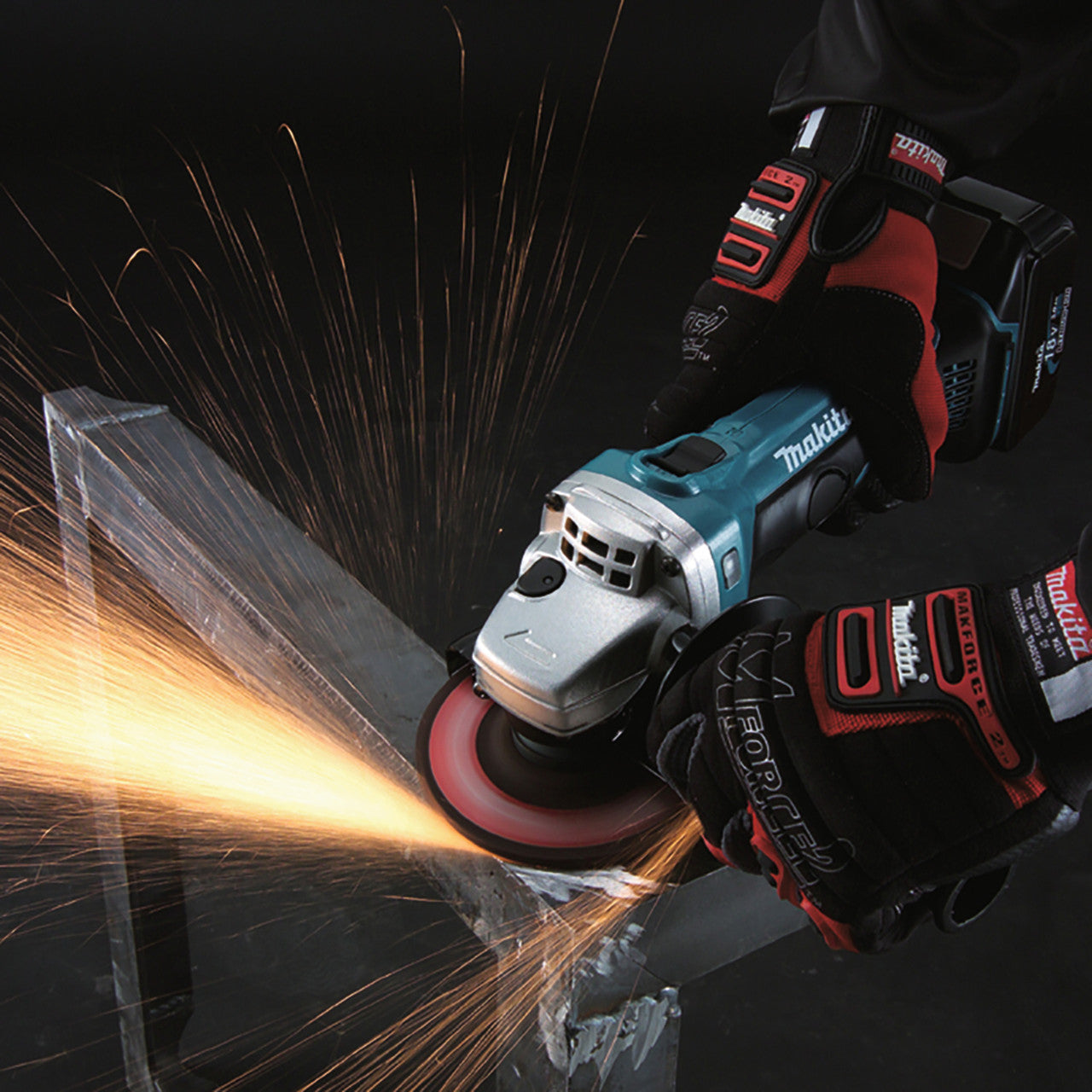 Makita DGA452Z 18V LXT 4.5 inch/115mm Angle Grinder (Body Only) in use grinding metal