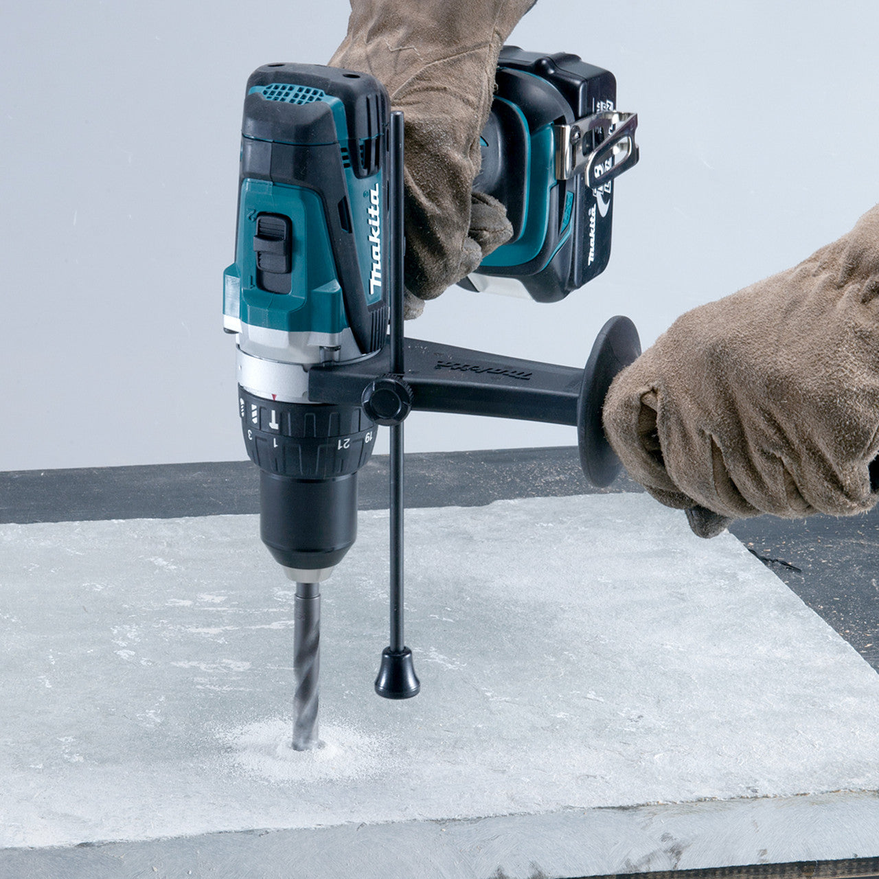 Makita DLX2145TJ 18V Combi Drill & Impact Driver Twin Pack (2 x 5.0Ah Batteries) combi in use drilling concrete