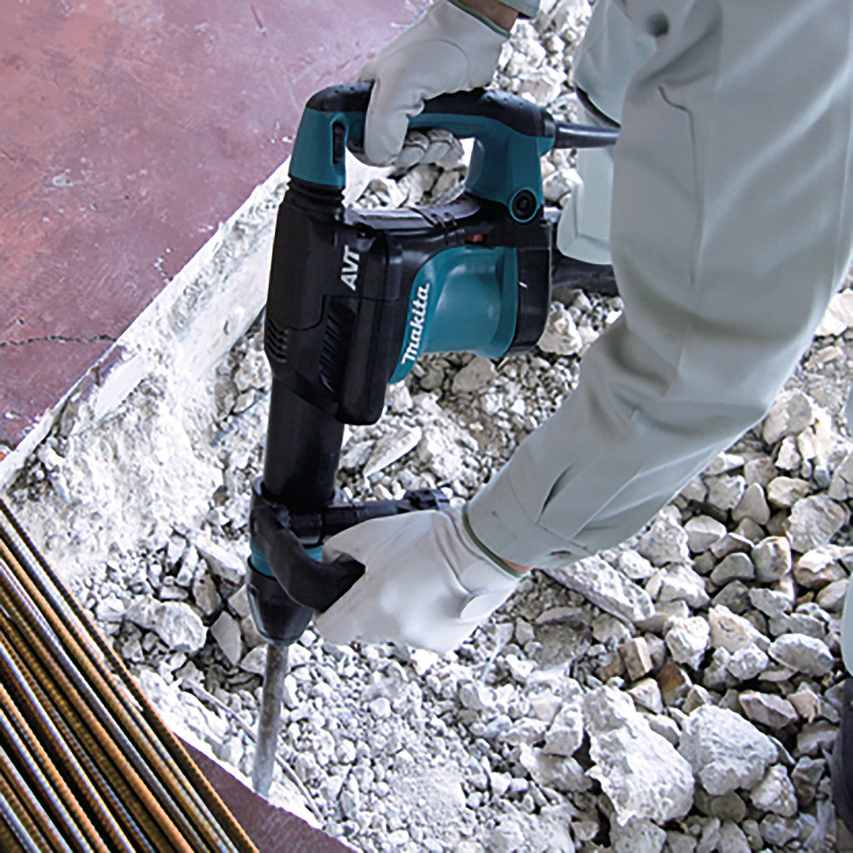 Makita HM0871C SDS Max Demolition Hammer with AVT (240V) in use demolishing concrete