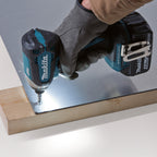 Makita DTD153Z 18V LXT Brushless Impact Driver (Body Only) close up screwing into metal