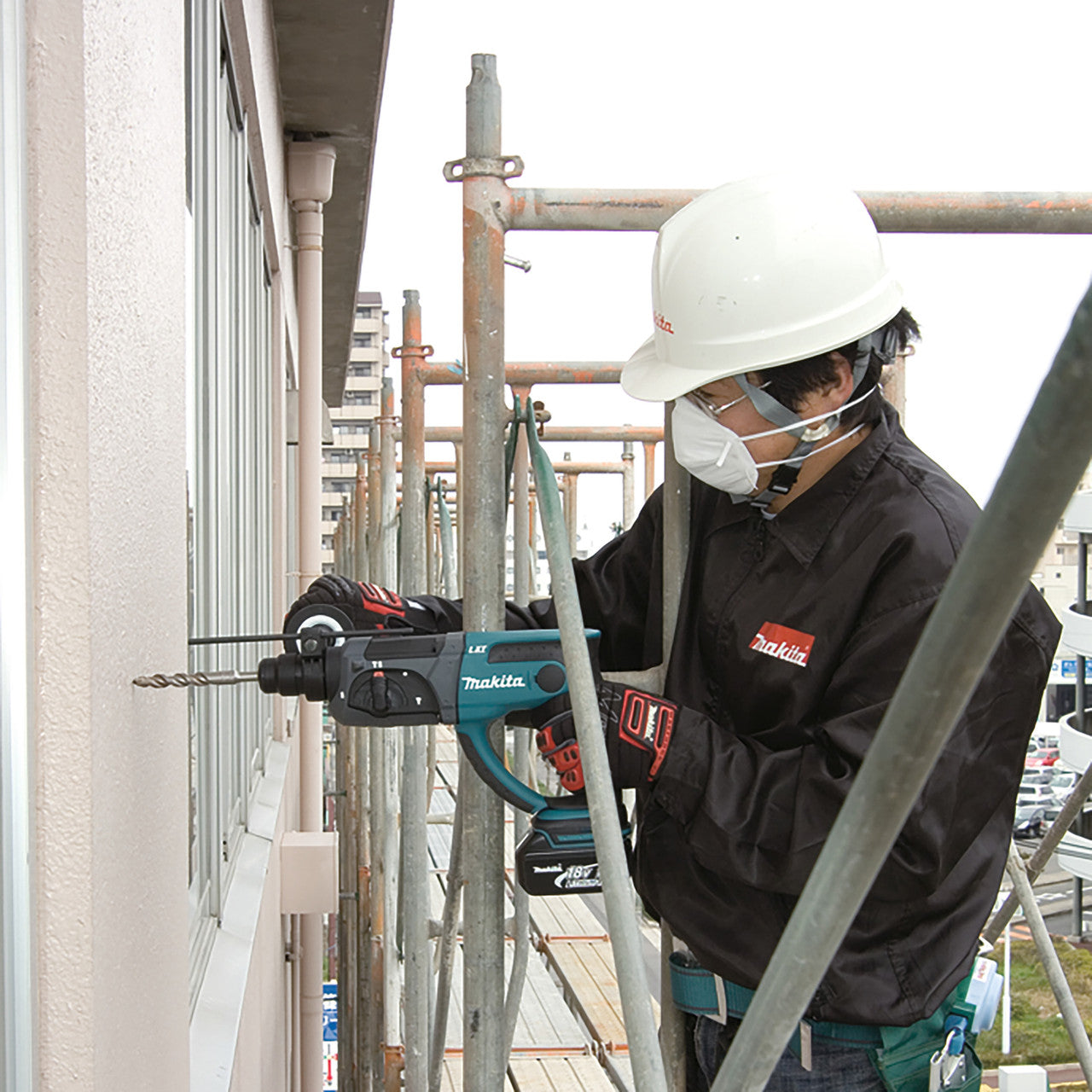 Makita DHR202Z 18V LXT SDS Plus Rotary Hammer Drill (Body Only) in use drilling into wall