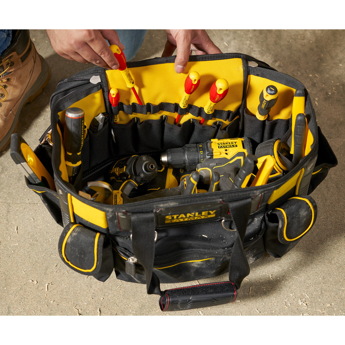 Stanley Fatmax FMST1-70749 Round Top Rigid Tool Bag 20'' on jobsite stacked with tools
