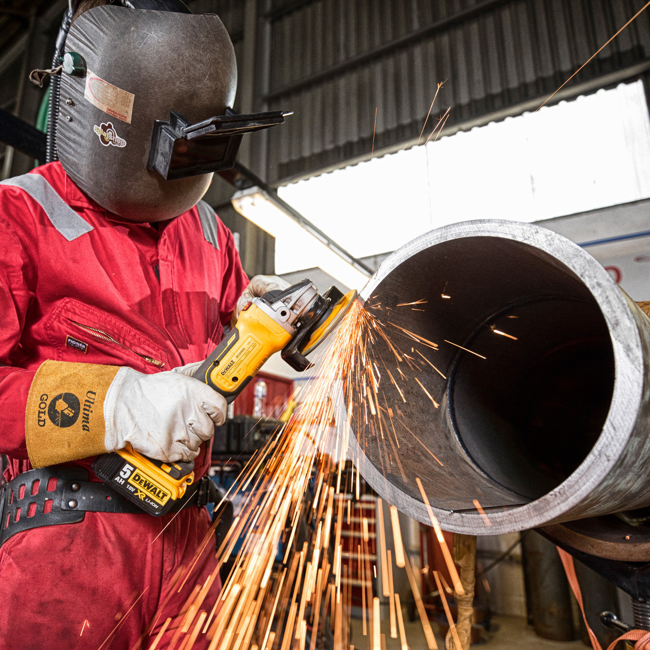 Dewalt DCG405N 18V XR 5 inch/125mm Brushless Angle Grinder (Body Only) in use grinding pipe