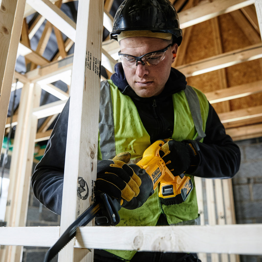 Dewalt DCS380N 18V XR Reciprocating Saw in use cutting wooden framework