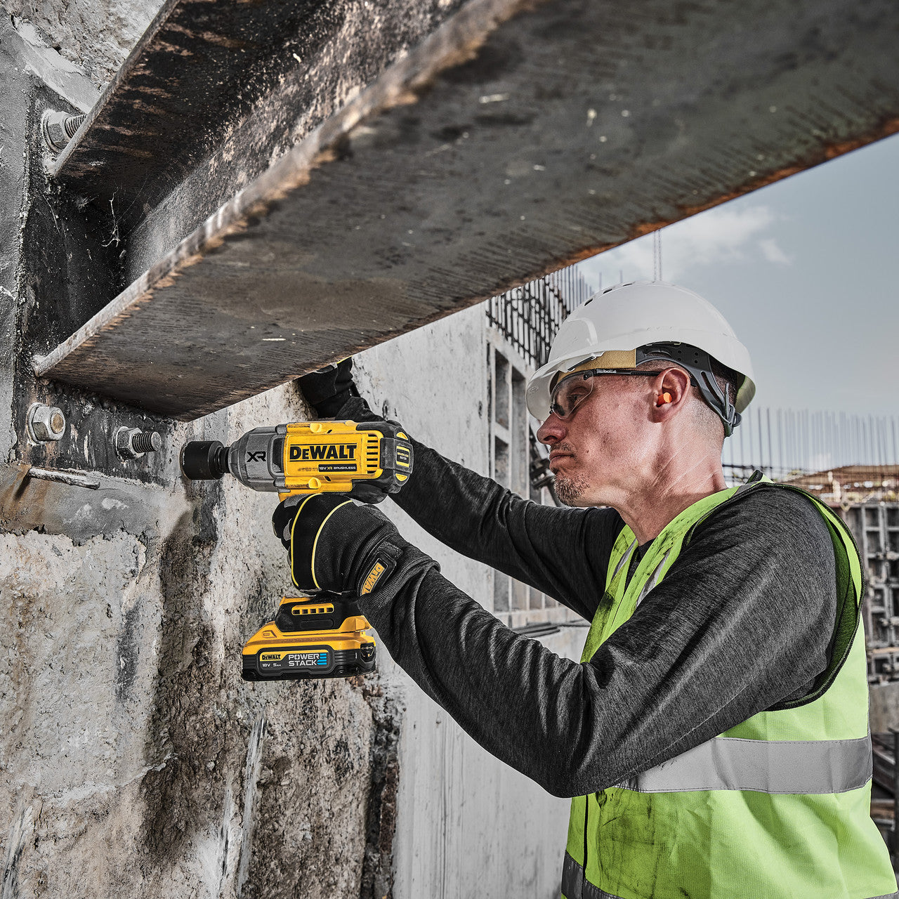 Dewalt DCF900N 18V XR Impact Wrench in use tightening large beam bolts