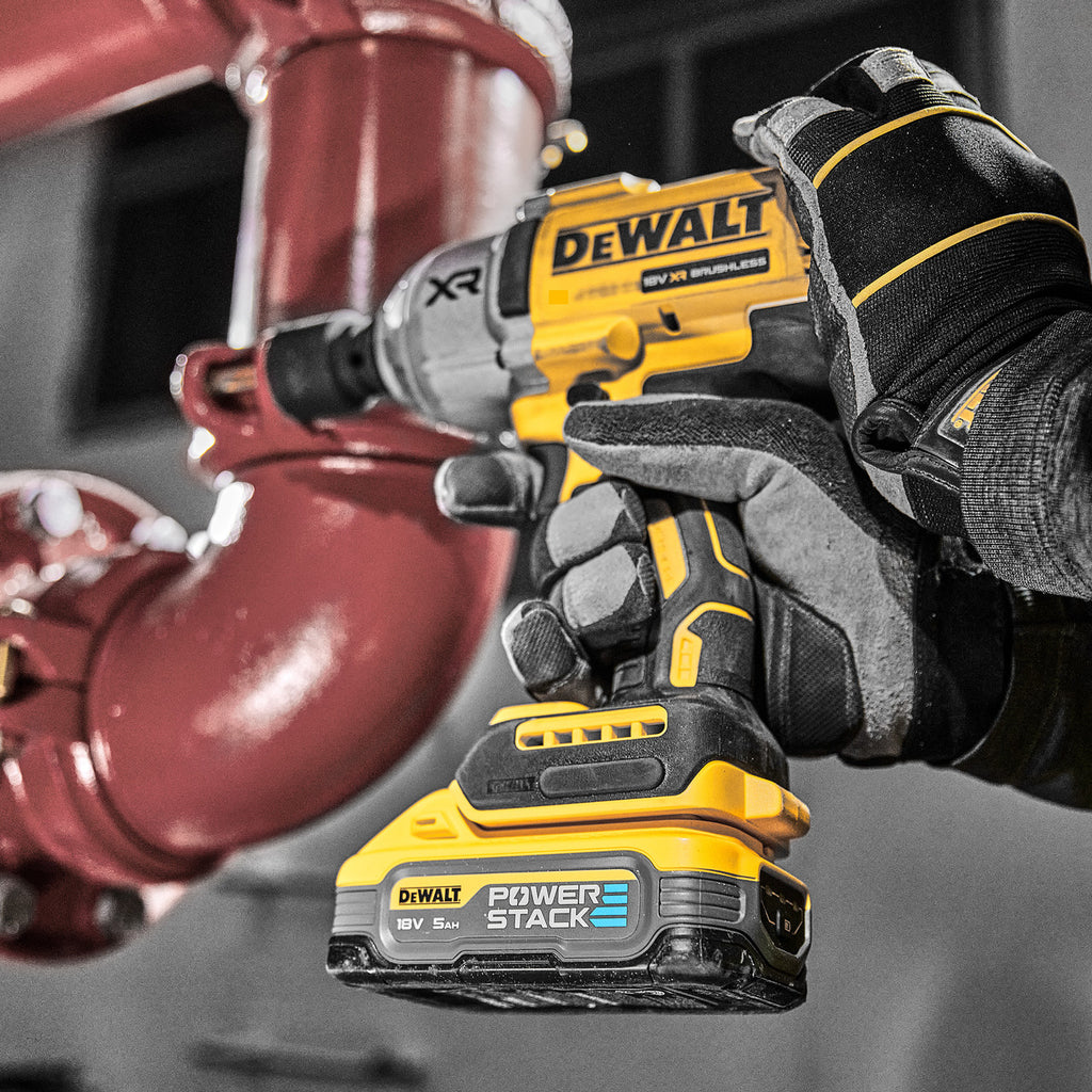 Dewalt DCF900N 18V XR Impact Wrench in use tightening pipe bolt
