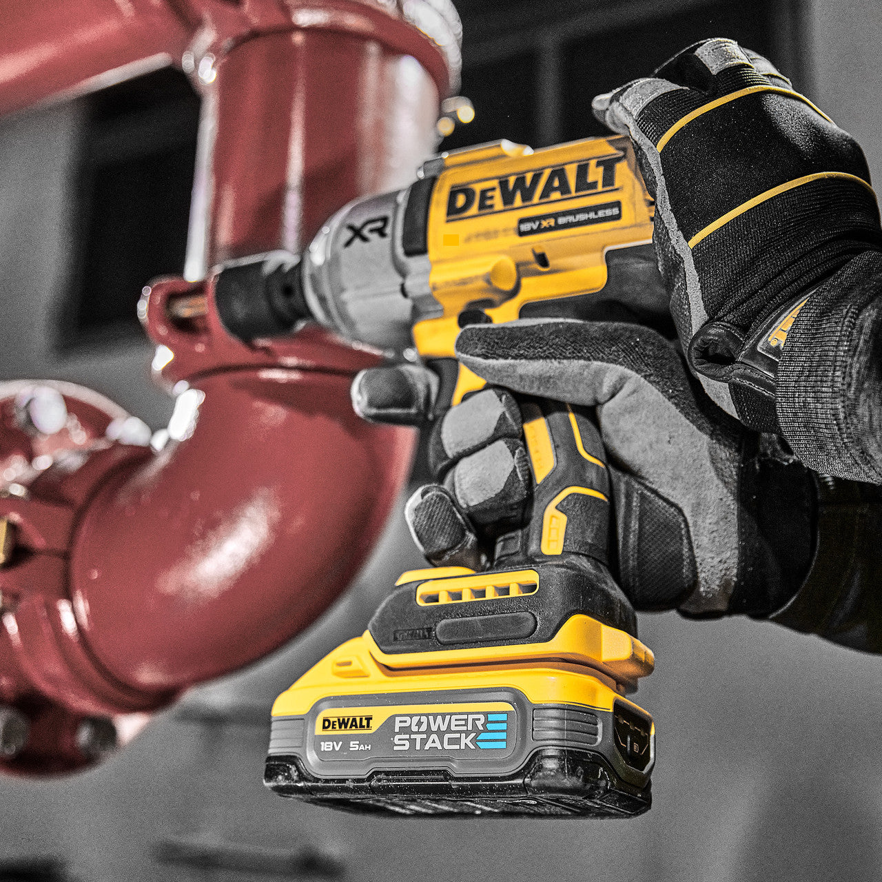 Dewalt DCF900N 18V XR Impact Wrench in use tightening pipe bolt