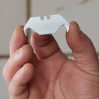 Stanley 0-11-983 Hooked Knife Blade held in hand